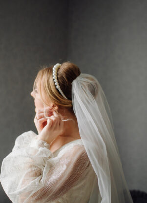 Bride with a long cathedral veil in a wedding portrait