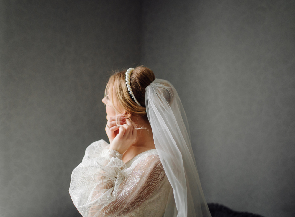 Bride with a long cathedral veil in a wedding portrait