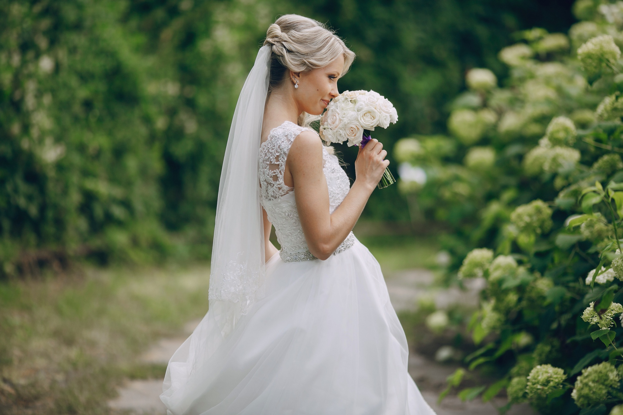 Bride wearing a veil and white wedding dress